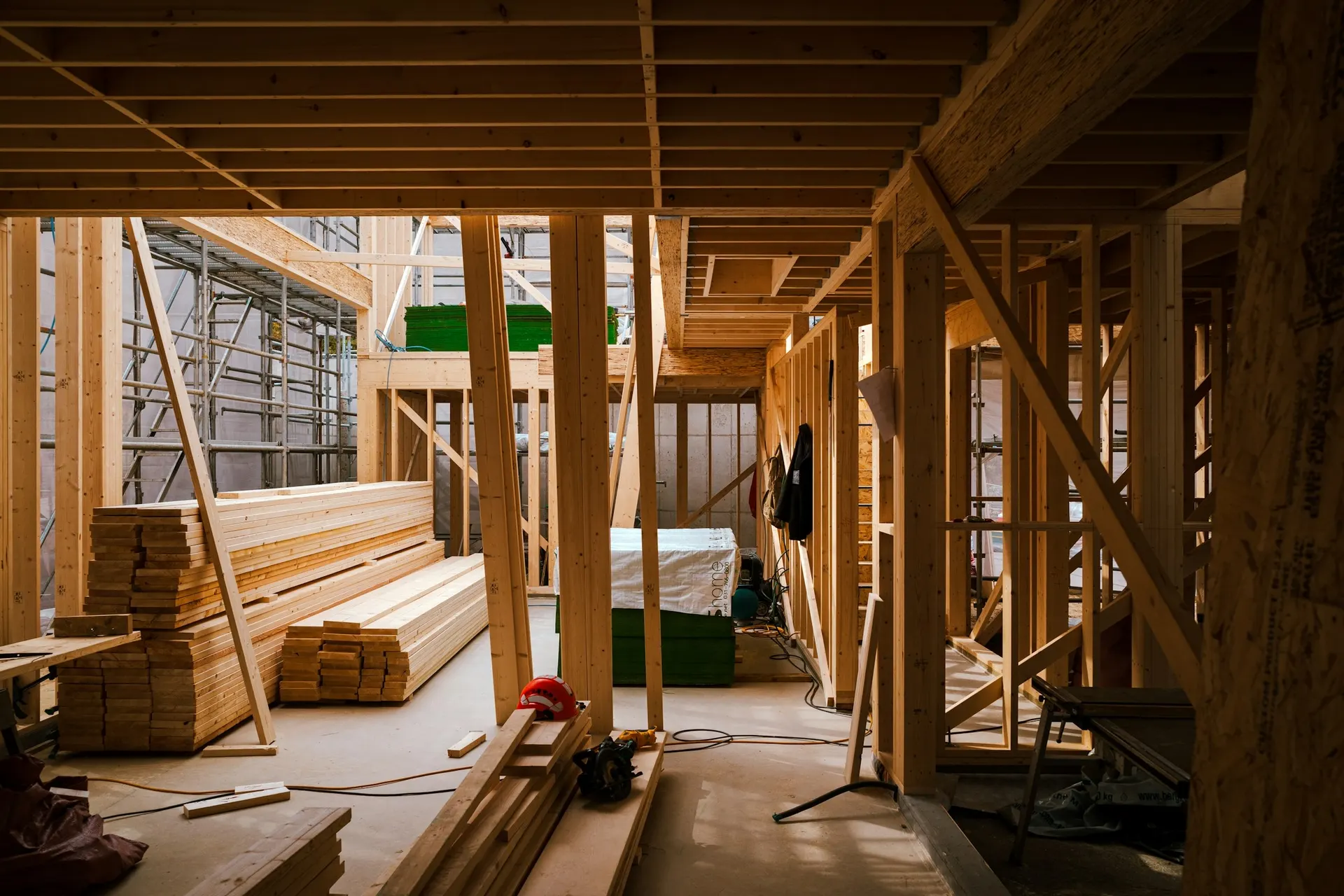A home mid-renovation, framed to the studs with light coming through