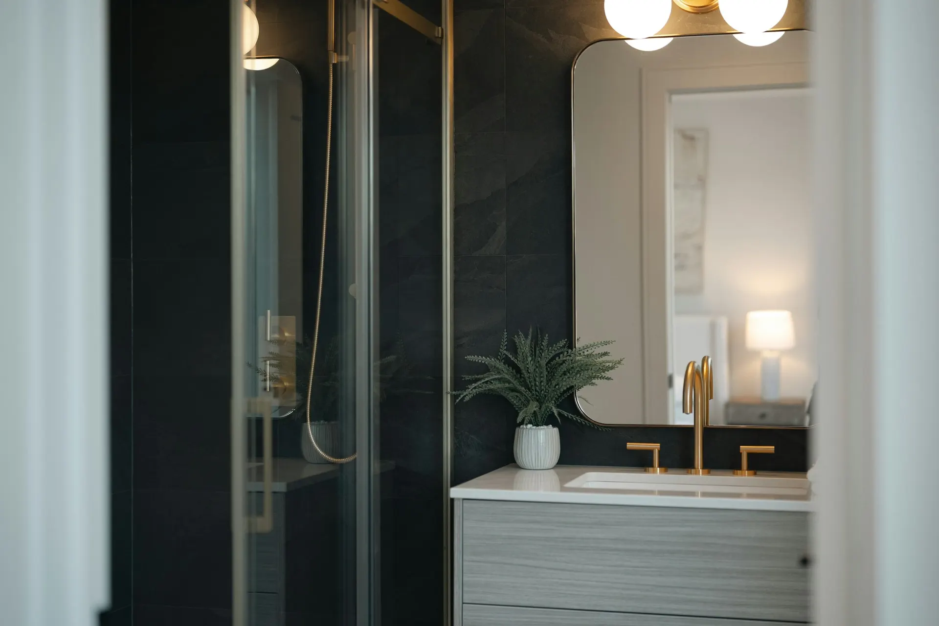 A modern bathroom vanity with brass fixtures