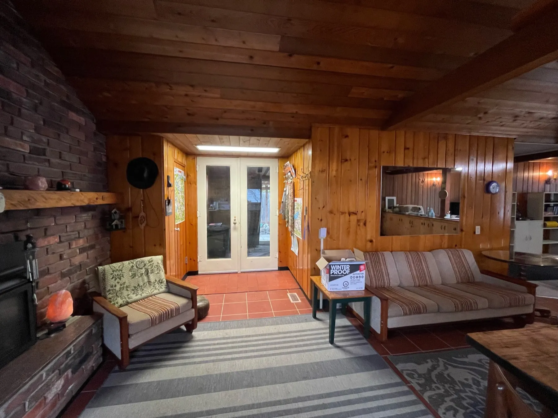 Haliburton Cottage, fireplace and side entry before the renovation